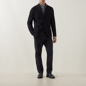 Model wearing Eleventy blue wool-blend jacket with matching trousers, styled over a collared shirt and dark loafers.