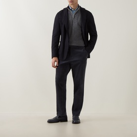 Model wearing Eleventy blue wool-blend jacket, styled with grey zip-neck sweater, blue shirt and dark tailored trousers