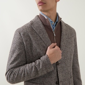 Model wearing Eleventy Check Single-Breasted Blazer in brown, styled with a brown zip-neck knit and blue shirt underneath.