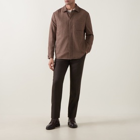 Model wearing Eleventy red wool-blend jacket with zip front and chest pocket, styled with dark trousers and brown leather shoes.