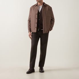 Model wearing Eleventy red wool blend jacket with dark trousers, layered over a waistcoat and white shirt, styled with dark loafers.