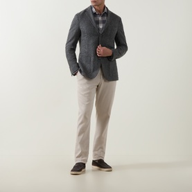 Model wearing Eleventy grigio medio melange wool-blend jacket, styled with plaid shirt, stone chinos and dark suede trainers.
