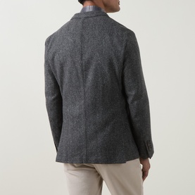 Model wearing Eleventy jacket in Grigio Medio Melange, rear view showing wool-blend construction, styled with beige trousers