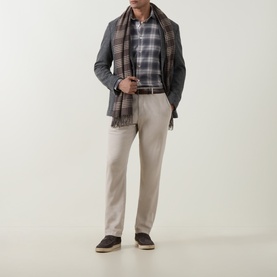 Model wearing Eleventy grigio medio melange wool-blend jacket, styled with plaid scarf, check shirt, and stone trousers.