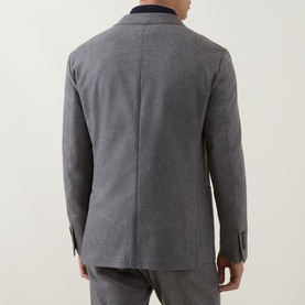 Model wearing Eleventy Brushed Single-Breasted Blazer in grey, rear view showing double vent and buttoned cuffs, styled with matching grey trousers.