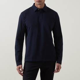 Model wearing Eleventy long-sleeve polo in Blu Nuovo, 100% cotton with a classic collar and zip placket, styled with black trousers