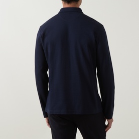 Model wearing Eleventy long-sleeve polo in Blu Nuovo, 100% cotton, rear view, styled with navy trousers