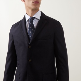 Model wearing Eleventy Single-Breasted Two-Piece Suit in blue wool-cashmere blend, styled with a light blue shirt and patterned tie