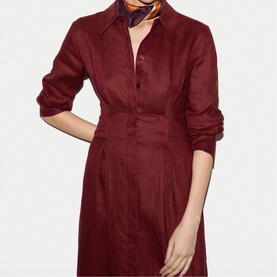 Model wearing burgundy linen shirt dress with collar, button front, and fitted waist, styled with a printed neck scarf