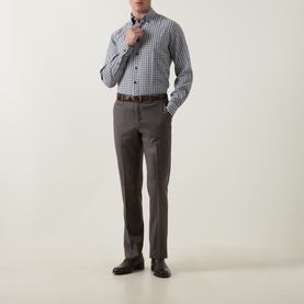 Model wearing Slowear mid grey gingham check cotton casual shirt with brown trousers and dark leather oxford shoes
