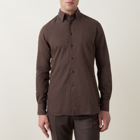Model wearing Slowear Solid Single-Cuff Shirt in dark brown cotton, featuring kent collar and button fastening, styled with matching trousers.