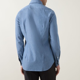 Model wearing Slowear Solid Single-Cuff Shirt in light blue cotton, rear view showing knife pleats and curved hemline.