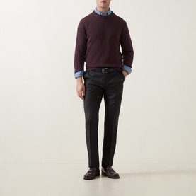 Model wearing Slowear Rib Knit Sweater in burgundy wool with crew neck, styled with blue shirt, dark trousers and loafers
