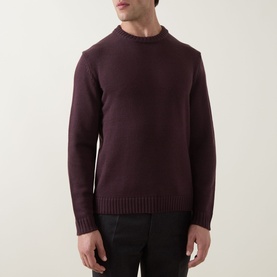 Model wearing Slowear Rib Knit Sweater in burgundy, crew neck, long sleeves, ribbed trims, styled with dark trousers.
