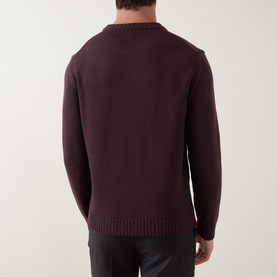 Model wearing Slowear Rib Knit Sweater in burgundy, rear view showing crew neck, long sleeves and ribbed hem. Styled with dark trousers.