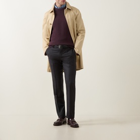Model wearing Slowear Rib Knit Sweater in burgundy crew neck, styled with beige overcoat, dark trousers and brown loafers.