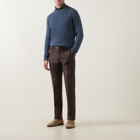 Model wearing Slowear Blue Rib Knit Sweater with crew neck, styled with dark brown trousers and tan suede shoes.