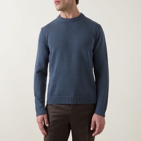 Model wearing Slowear Rib Knit Sweater in blue, crew neck with ribbed trims, styled with brown trousers.