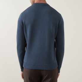 Model wearing Slowear Rib Knit Sweater in blue, rear view, crew neck, ribbed trims, styled with dark trousers