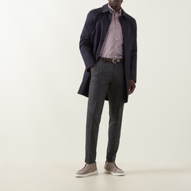 Model wearing Slowear grey wool-cashmere formal trousers, styled with a navy overcoat, pink shirt, brown belt, and taupe loafers.