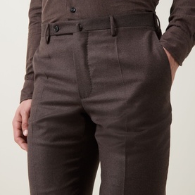 Model wearing Slowear Straight Leg Trousers in brown wool-cashmere, showing buttoned tab waistband, belt loops and side pockets, styled with brown