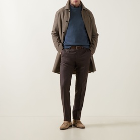 Model wearing Slowear Straight Leg Trousers in brown wool-cashmere, styled with a taupe overcoat, blue roll-neck and suede loafers.