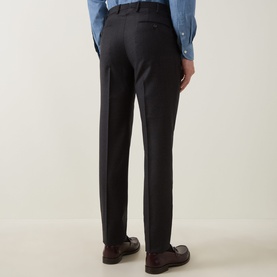 Model wearing Slowear Straight Leg Trousers in charcoal wool-cashmere, styled with a blue shirt and brown leather loafers, rear view.