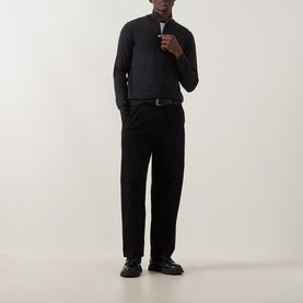 Model wearing Slowear charcoal half zip knitwear with black tailored trousers, belt, and leather shoes