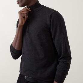Model wearing Slowear charcoal wool half-zip knit, close-up showing zip collar detail and fine-knit texture.