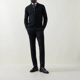 Model wearing Slowear green wool half zip jumper, styled with dark trousers, collared shirt and black loafers