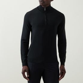 Model wearing Slowear green wool half-zip knit, long sleeves, close-fitting silhouette with short zip placket at collar