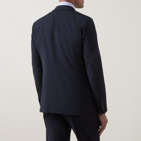 Model wearing Strellson navy suit jacket, rear view, single vent, slim fit, styled with white shirt and matching trousers