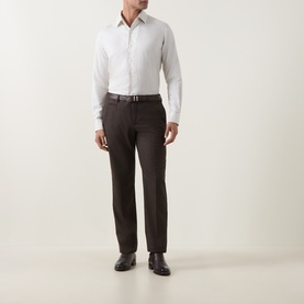 Model wearing Strellson black suit trousers in wool blend, styled with a white shirt, brown belt and dark leather shoes.