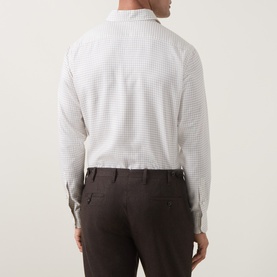 Model wearing Strellson black suit trousers, styled with a white micro-print shirt, rear view showing tailored fit