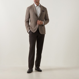 Model wearing Strellson black suit trousers styled with a brown check blazer, white shirt, and black leather shoes.
