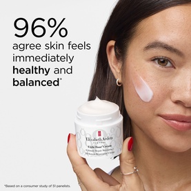 Model with Elizabeth Arden Eight Hour Cream moisturiser applied to cheek, shown alongside open jar with 96% skin feels healthy claim.