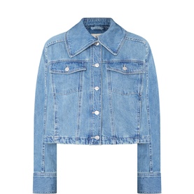 Free People cropped denim jacket in River Wash blue, spread collar, chest pockets, silver button fastening, raw hem detail