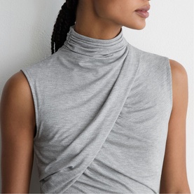 Model wearing Reiss grey marl sleeveless top with draped wrap front and high ruched neckline detail