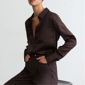 Model wearing Reiss grape burgundy satin shirt with matching tailored trousers and gold-tone belt