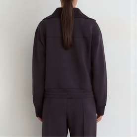 Model wearing Reiss grape burgundy zip-neck sweatshirt, back view, styled with matching wide-leg trousers