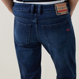 Diesel 3049 dark blue skinny jeans, rear view showing branded leather patch, red logo stitch detail and back pockets.