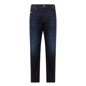 Diesel 1986 Larke-Beex Tapered Jeans in dark blue, mid-rise with zip-fly, five-pocket design, tobacco stitching and dark wash finish.