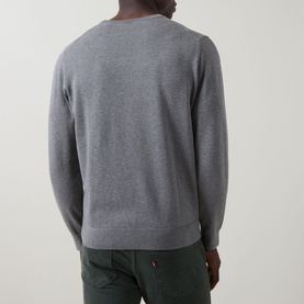 Model wearing Gant Classic Shield Sweater in dark grey melange, crew neck, ribbed trims, back view, styled with olive green trousers.