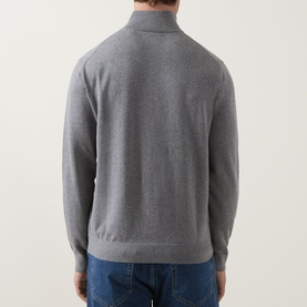 Model wearing Gant Shield Logo Half-Zip Sweatshirt in dark grey melange, rear view showing funnel neck and ribbed hem, styled with blue jeans.