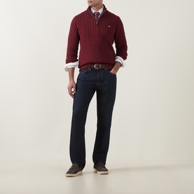 Model wearing Gant Deep Grape Wine cotton cable-knit half-zip sweater, styled with dark jeans, collared shirt and brown suede shoes.