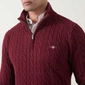 Model wearing Gant Deep Grape Wine cotton cable-knit half-zip jumper, styled over a white collared shirt.