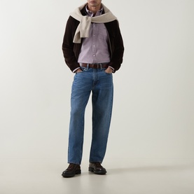 Model wearing Gant Deep Grape Wine cotton Reg Shirt, styled with dark brown jacket, cream scarf and blue straight-leg jeans.