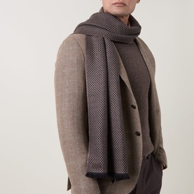 Model with Canali Textured Logo Wool Scarf in beige two-tone knit, draped over shoulders, styled with a camel blazer and dark top.