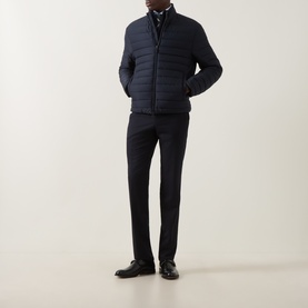 Model wearing Canali navy quilted casual jacket, styled with dark trousers and black leather shoes.