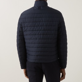 Model wearing Canali navy casual jacket, back view, quilted front panel, smooth side panels, stand collar
